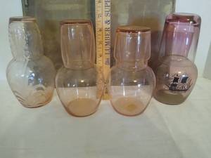 lot 2018 image: 4 - pink bedside carafes  1 has a pirate ship design