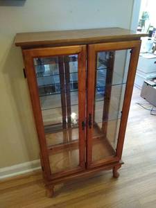 lot 2032 image: Lighted display cabinet- needs new light bulb (minor damage - see pictures) 43 X 24 X 12 D
