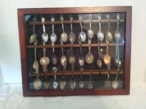 lot 2063 image: Collector spoons in display case - some marked sterling925
