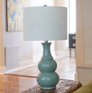 lot 22351 image: Stock Photo Updated  Copper Grove Arans Table Lamp with Off-white Drum Shade (26.5)