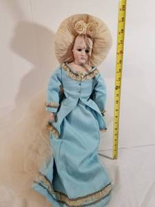 lot 2010 image: Beautiful Porcelain Doll with Headdress.