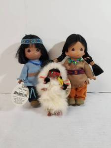 lot 2016 image: Two Precious Moments Native American Dolls. One Alberta Game Farm Doll.