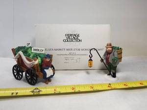 lot 2057 image: Heritage Village Collection. Chelsea Market Mistletoe Monger and Cart. Department 56