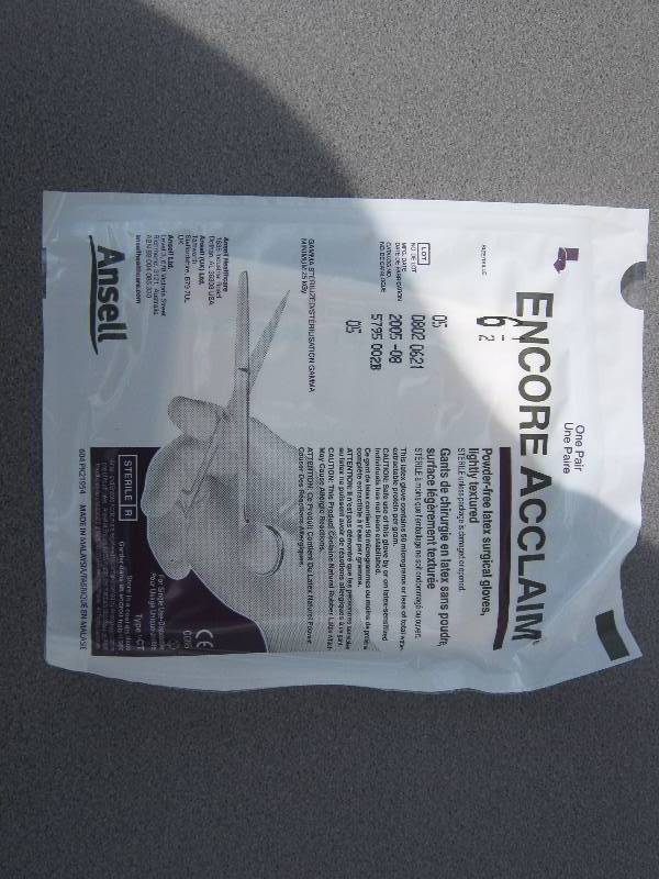 lot 3107 image: 100 ct. lot Encore Acclaim Powder Free surgical gloves size 6-12 each package contains one pair mfg. date 082005