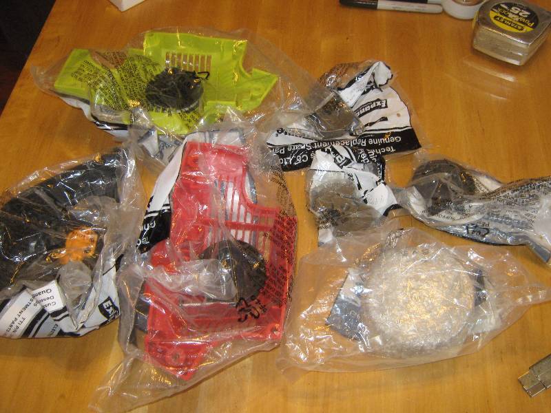 lot 3234 image: large lot Homelite chainsaw repair parts in packaging