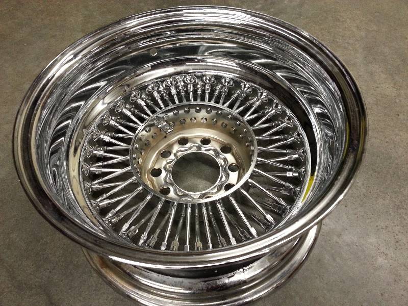 lot 1476 image: New single 15 X 7 inch Crown 60 chrome spoke wire wheel with Reverse off set and a dual bolt pattern of 5 lug Chevy & GM 4-34 and also the 5