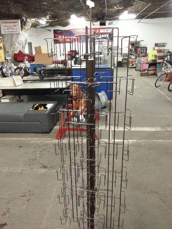 lot 1492 image: 70 tall and spinning 4 sides of literature Brown painted display rack