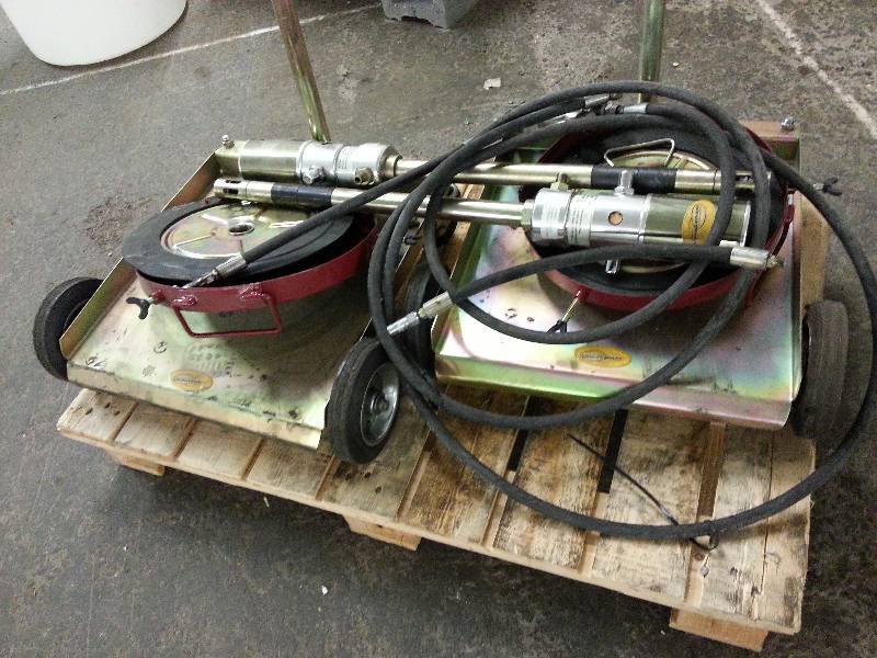 lot 1494 image: A small pallet full of (2 carts) portable lubrication 31 (30 gallon drum size) cart components left from a warehouse closing