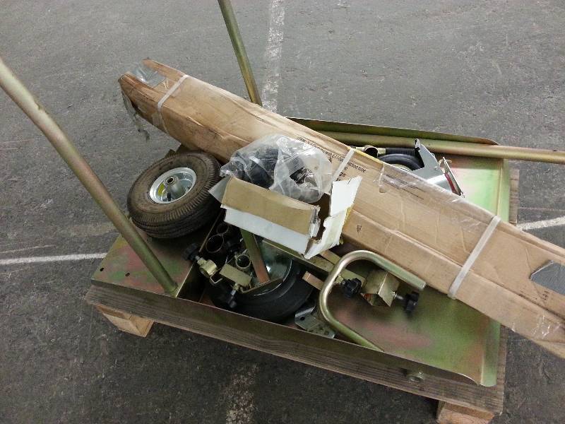 lot 1495 image: A small pallet full of portable lubrication 51 (55 gallon drum size) cart components left from a warehouse closing.