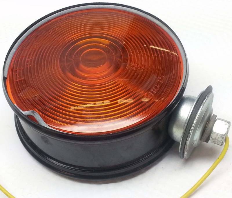 lot 1509 image: Single School bus or truck fender hood mounted turn signal light assembly Amber & Red.