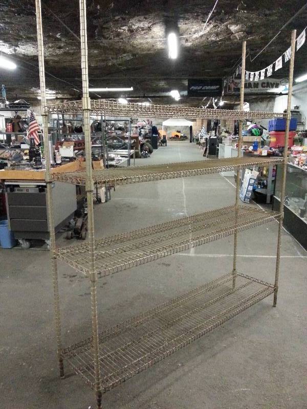 lot 1514 image: A little rusty but plenty functional is the Metro adjustable 4 shelf 72 X 17-12 X 86 tall style storage rack