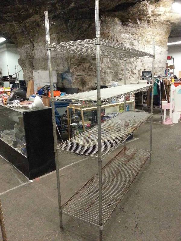 lot 1515 image: A little rusty but plenty functional is the Metro adjustable 4 shelf 72 X 17-12 X 75 tall style storage rack