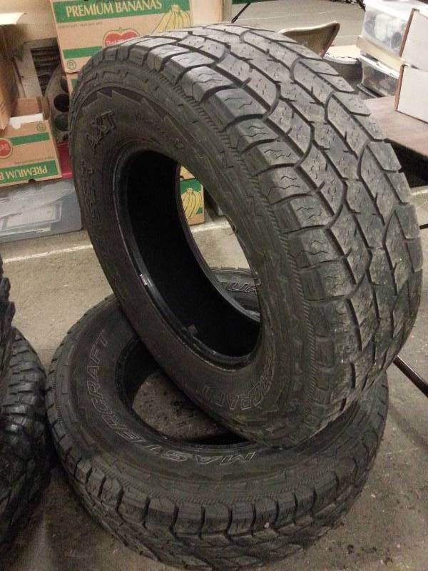lot 1537 image: 10,000 miles left is this pair of LT 27570R-18 truck all terrain Mastercraft Courser AXT truck tires