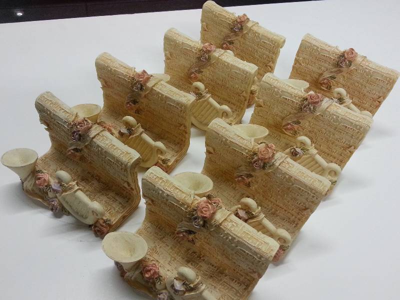 lot 9069 image: Gang of 8 paper weights or desk top letter holders.  Not sure of the material these are made of nice detail and color