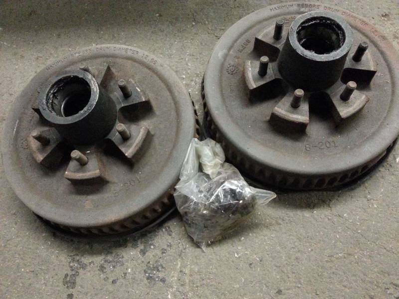 lot 1541 image: Pair of heavy duty Dexter trailer axle electric brake sets including the bolt on backing plates.