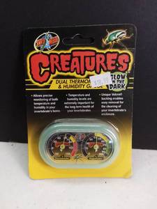 lot 5090 image: Zoo Med Creatures Glow in the Dark Dual Thermometer and Humidity Guage