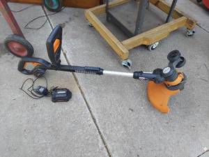 lot 3001 image: Worx 20V String Trimmer with 2 Batteries and Charger