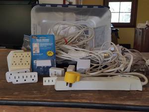 lot 3246 image: lot of extension cords with container