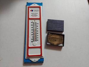 lot 3300 image: Advertising Items - Belt Buckle and Plastic Thermometer