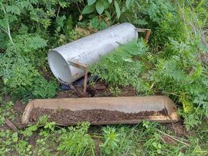 lot 6106 image: 2 Feed Bunk  Planters Made From Tanks - 1 on Stand is Filled with Dirt, Bring a Shovel to Remove