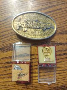 lot 6145 image: Cessna pins and belt buckle