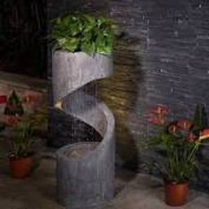 lot 14929 image: Glitzhome 31H Polyresin Curving Shaped Outdoor Fountain With LED Light- Retail$217.99 as is