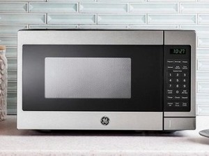 lot 2805 image: MISSING METAL PART FROM INSIDE SEE PICTURES GE.- 0.7 Cu. Ft. Compact Microwave- Stainless Steel. RETAILS$99.99