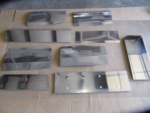 lot 1765 image: 9 Assorted chrome pieces, fender guards, license plate