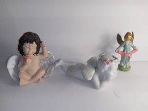 lot 2725 image: Lot Of 3 Angel Figurines - 1 Brown Hair With Apple - 1 Porcelain White Angel Baby - - 1 Lady Angel