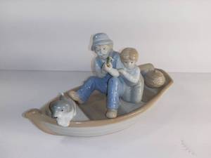 lot 2731 image: Porcelain Father And Son With Dog Fishing On Boat - Meico Inc Made In Republic Of China