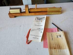 lot 1020 image: Vintage Charter Company. Wooden Nutcracker with Rubberband Spring Loaded Cracker