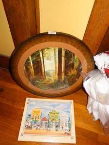 lot 19628 image: Large Round Framed Art of Trees and Mountain Town Cartoon