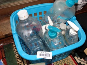 lot 19858 image: Partial Bottles of Soap and Hand Sanitizer