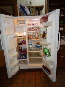 lot 19932 image: Great Working White Amana Side by Side Refrigerator with Ice Maker and Water in Door.