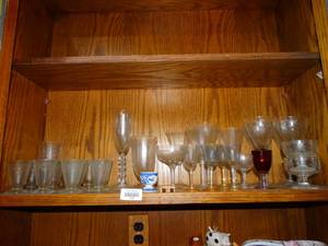 lot 19948 image: Lot of wine glasses and other stemmed glassware picture in cabinet