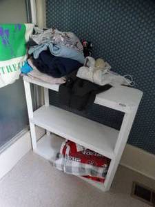 lot 35222 image: White Plastic Shelf with Misc. Bedding and Metal Wall Rack
