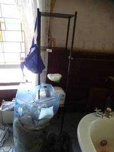 lot 35231 image: Black Metal Rack with Misc. Towels and Bedding