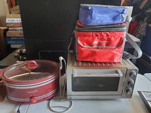lot 1366 image: Crock pot, Banana holder, Dino kids lunch box, Ozark trail cooler bag and Cuisinart Convection Toaster Oven Broiler
