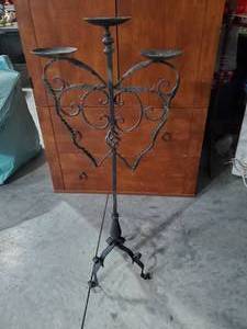lot 1393 image: Unique Black Metal 3- Tier Candle holder, Looks like a Butterfly shape.