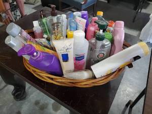 lot 1413 image: Basket full of assorted lotions, haircare and more..
