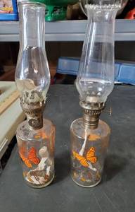 lot 1469 image: 2 Butterfly Oil Lamps