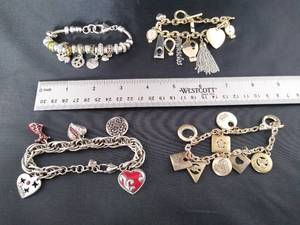 lot 1602 image: 4- Really cute charm bracelets
