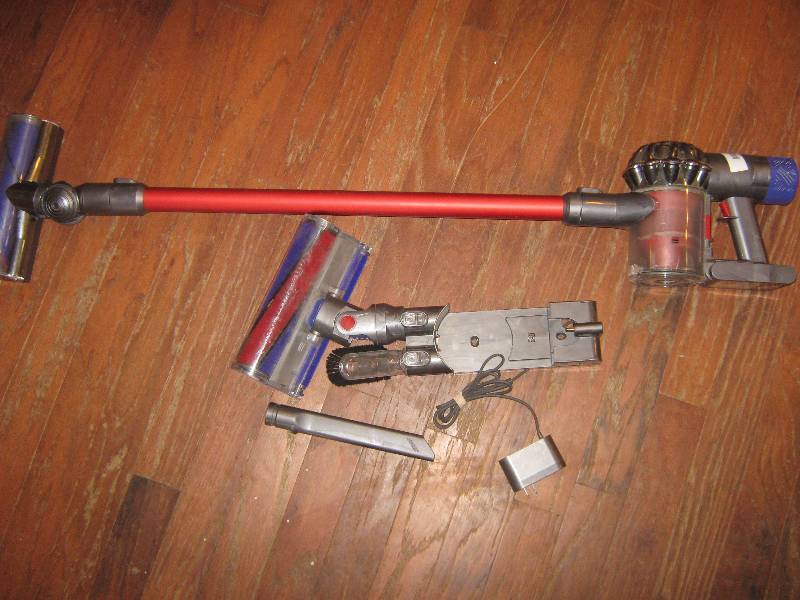 lot 5006 image: Dyson V6 Absolute Cordless Vacuum w charger and attachments, works, clean