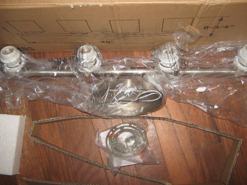 lot 5033 image: Kenroy Homes Light Fixture Silver Color, 30 long frosted white glass shades, holds 4 lights, hardware, instructions included