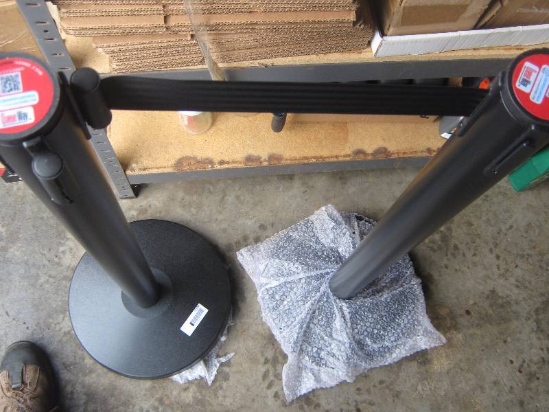 lot 5104 image: 2 ct. lot Queue Way Crowd Control Rope mechanism posts w base, belt up to 8 ft. long and 41 tall