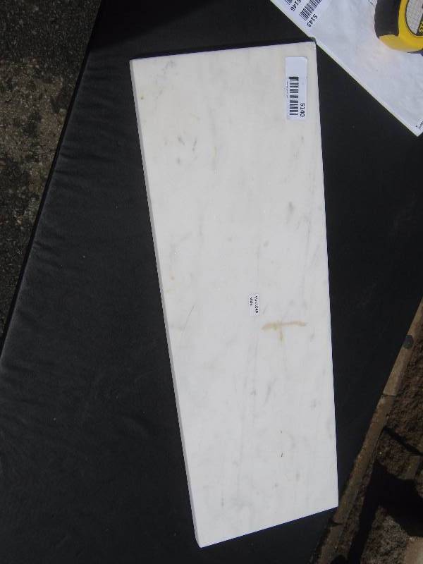 lot 5140 image: Rectangle piece of white marble 24 long x 8 wide x 1 deep, 50 lbs. max load