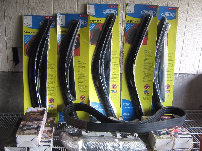 lot 5143 image: 13 piece auto accessories lot, vent visors, hood protectors, belt, one pair head lights