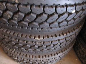 lot 5003 image: 3 NEW Lug Tread Recaps- 11x24.5
