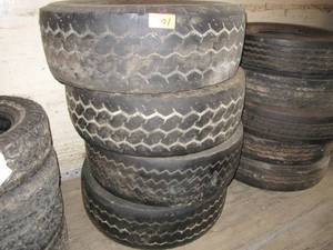 lot 5001 image: Lot of 4 425x65Rx22.5 Used Tires , Mainly used on Heavy Spec Trucks with Heavy Front Ales  , Dump Trucks , Crane Trucks, Concrete Trucks Etc.