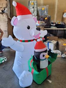 lot 1744 image: Polar bear and penguin Christmas blow up